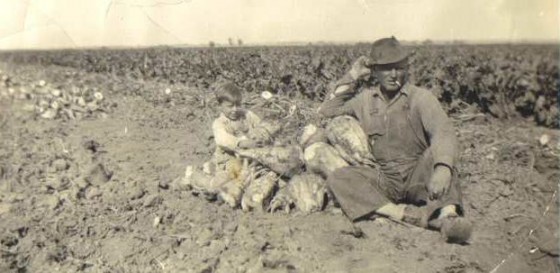 Ben Karst (Jacob Rommel's son-in-law) and son Jim, sitting by beet piles, 1941