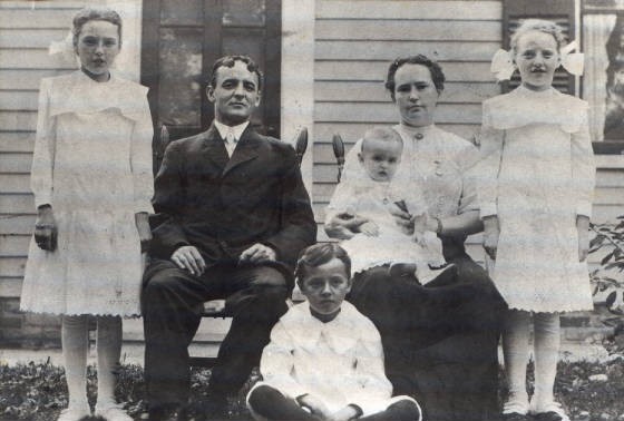 Eugene and Lucy with daughters Pearl (L), Blanche (R), sons Earl (baby), and Raymond, 1912.