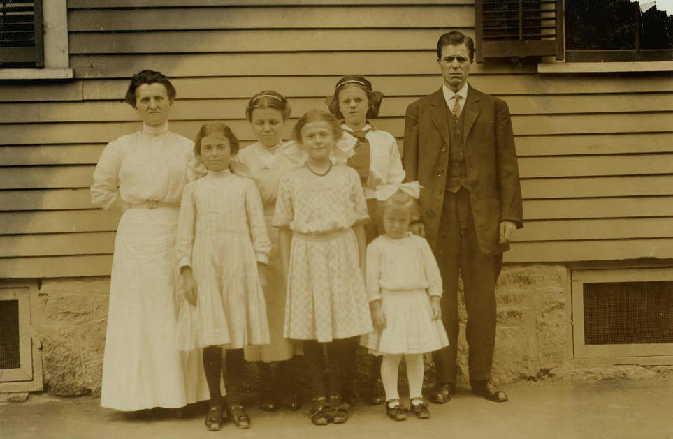Pothier family, Lawrence, Massachusetts, September 1911. Photo by Lewis Hine. Leda and Joseph Pothier with their children: (L-R) front row: Anita, 11; Antoinette, 14; Irene, about 5; back row: Blanche, about 17; Yvonne, about 15.