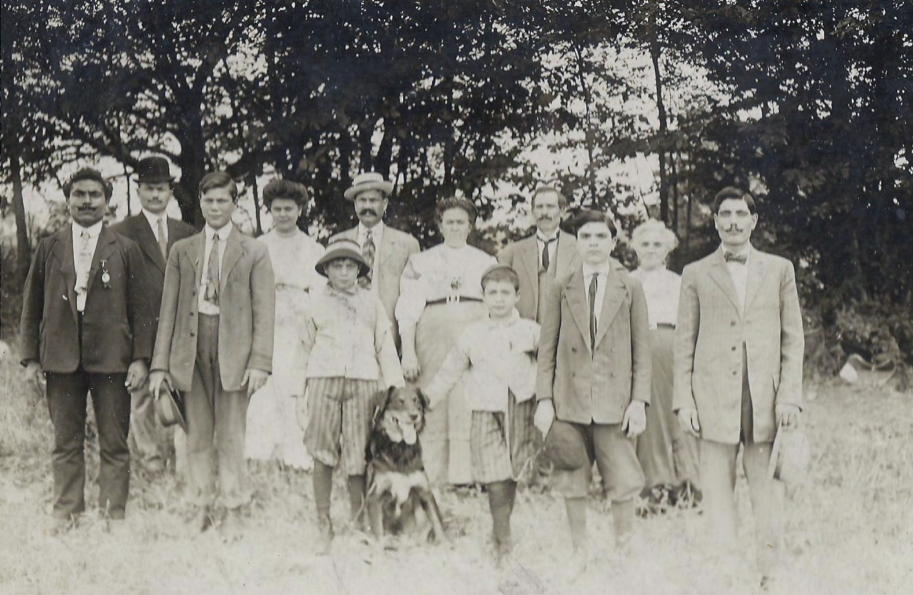 Centola family & friends, 1907. Guido Centola (first boy on left in front row, wearing a hat); his parents, Joseph and Mary (middle of back row, man with hat and mustache, women standing to his left).