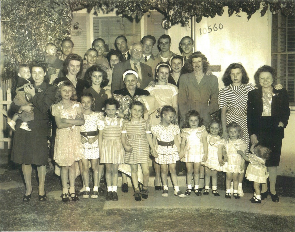 (People in this photo who are also in the Hine photo): Back row: Earl (first man on left), Kendall (second man from left), Edward Jr. (fourth man from left), Everett/Jimmy (fifth man from left), Orville (on far right); in rows below: father Edward Sr. (man in middle wearing glasses and a tie), Bridget/Bee (on left holding child), mother Pearl (in middle, directly below Edward Sr.), and Edith (on far right wearing black). Others in family who performed: Olive (immediately to Pearl's left), and Dolly (to Olive's left, with her right hand on Olive's shoulder). Also in picture is Bobbi Toro, whose interview appears in this story (third from right in bottom row). 1946