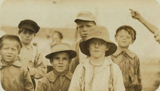 Joseph Alves (front, 2nd from left), 8 yrs old, Biloxi, Miss., February 1911. Photo by Lewis Hine.