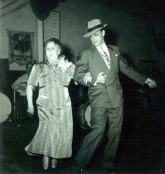 Pearl Capps and her son Earl doing the "cake walk" at her 50th wedding anniversary, 1952.